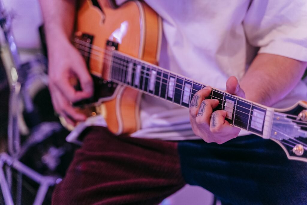 Person Playing an Electric Guitar